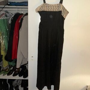 Elegant vintage black midi with lace detail—sourced from iconic C. Madeleine’s